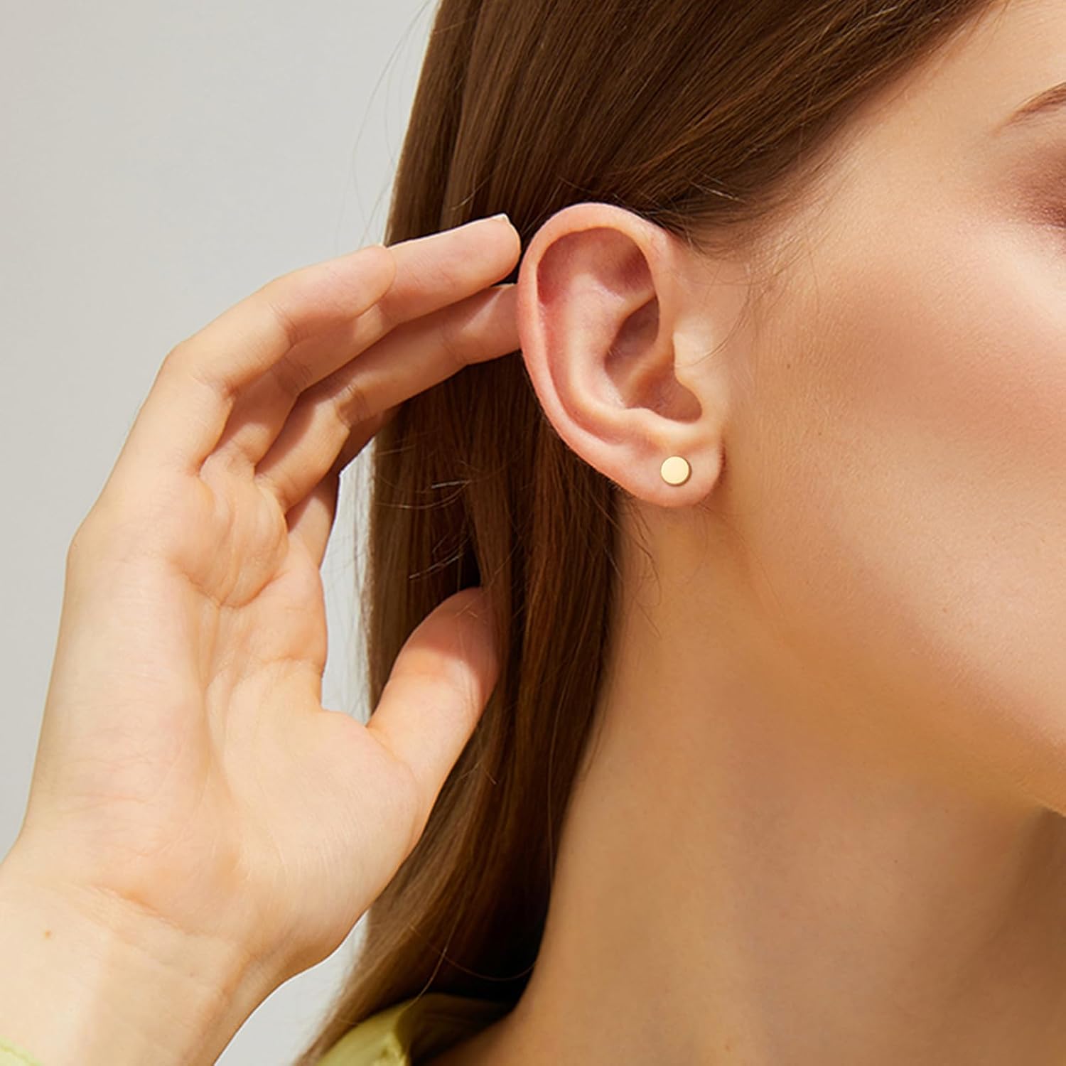 Calf: Minimalist gold stud earrings