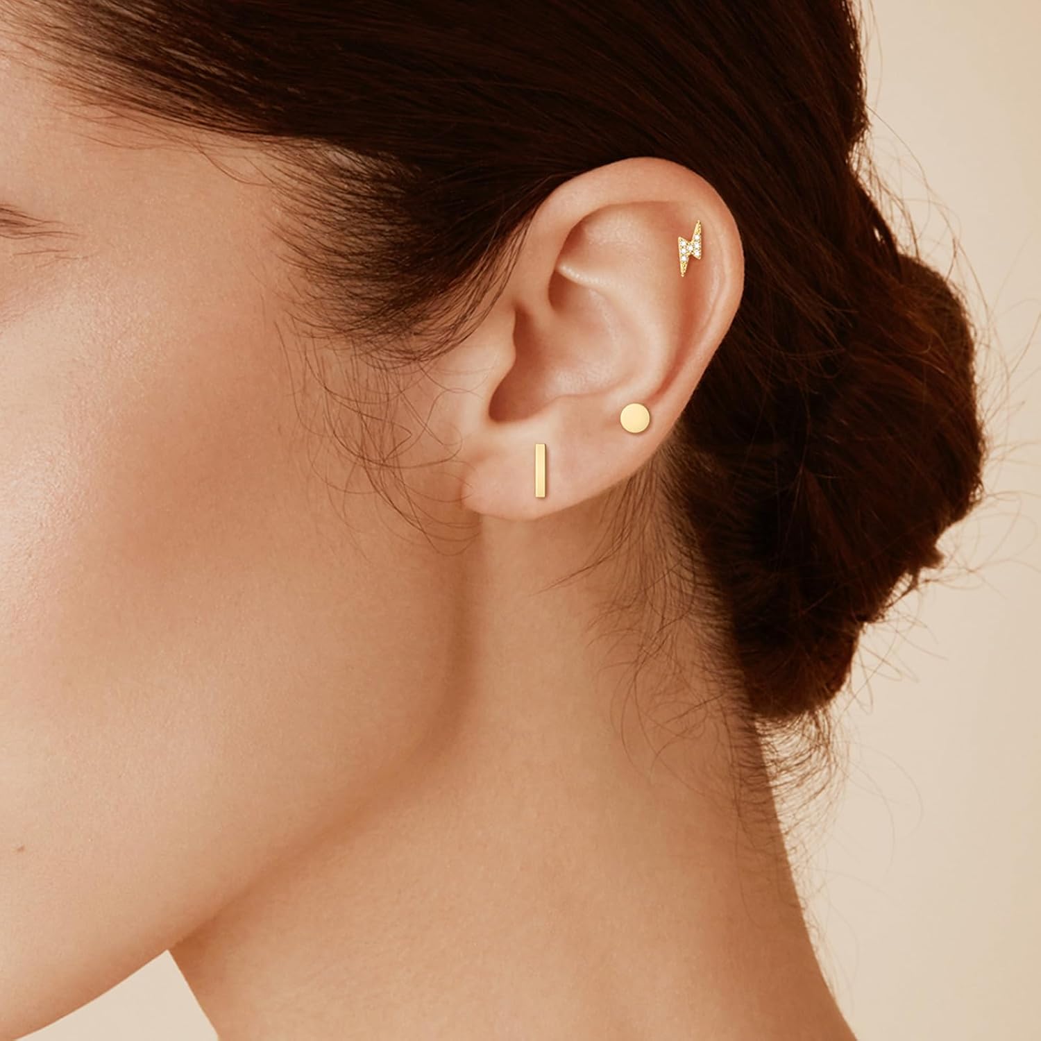 Calf: Minimalist gold stud earrings