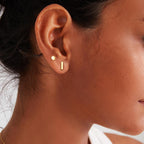 Calf: Minimalist gold stud earrings