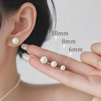 Calf: Pearl stud earrings