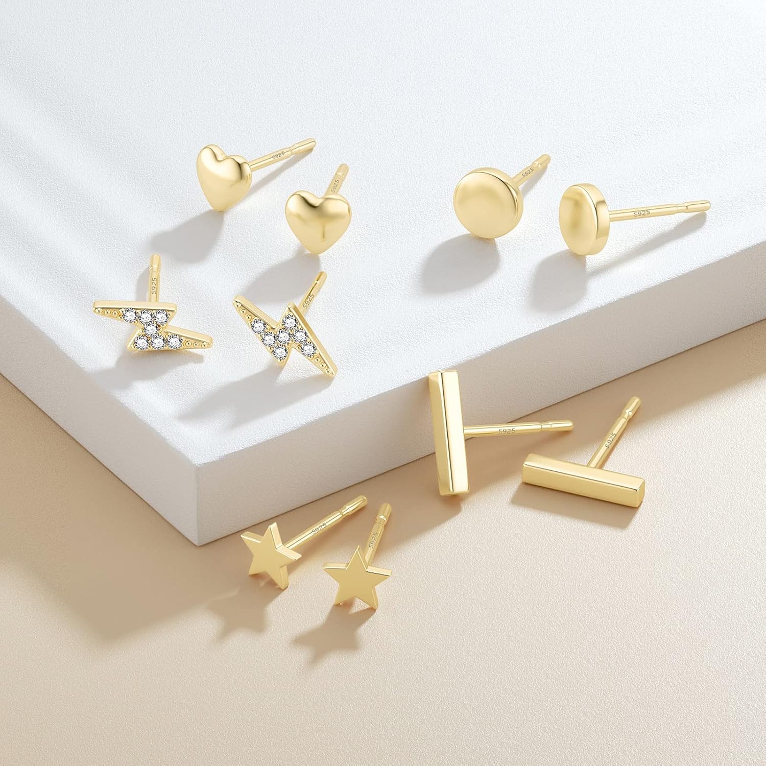 Calf: Minimalist gold stud earrings
